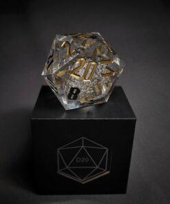 Transparent dice with bubble inside and golden numbers standing on a black box with 