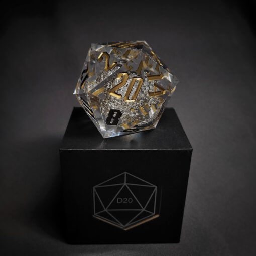 Transparent dice with bubble inside and golden numbers standing on a black box with "D20" written on it.