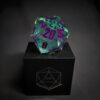 Green Transparent dice with bubbles inside and purple numbers standing on a black box with "D20" written on it.