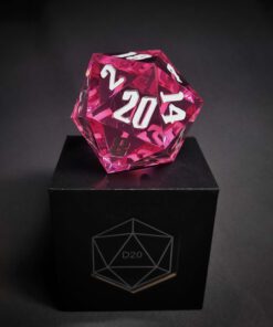 A pink transparent dice with bubbles inside and white numbers standing on a black box with "D20" written on it.