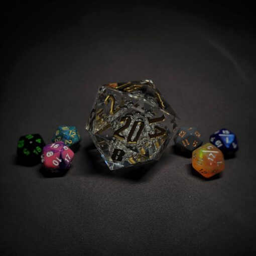 An extra large transparent d20 die with bubbles and golden numbers sitting in the middle of 6 smaller d20 dice.