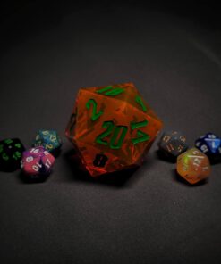 An extra large orange transparent d20 die with green numbers sitting in the middle of 6 smaller d20 dice.