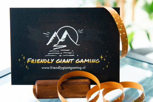 The rear side of a gift card with a Friendly Giant Gaming logo