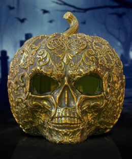 A fancy pumpkin head with different markings on it. The face is in the shape of a skull
